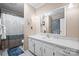 Bright bathroom featuring full vanity with large mirror, shower-tub combo, and tile floors at 112 Gays Chapel Rd, Statesville, NC 28625