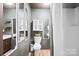 Bathroom featuring decorative mirrors, a modern toilet, and a shower with a curtain at 112 Gays Chapel Rd, Statesville, NC 28625
