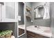 Bathroom boasts a large sink, decorative mirrors, and convenient storage shelves for organization at 112 Gays Chapel Rd, Statesville, NC 28625