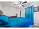 This bedroom features a ceiling fan and blue accents that give it a cool and relaxed feel at 112 Gays Chapel Rd, Statesville, NC 28625