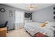 Cozy bedroom featuring neutral walls and ceiling fan and small shelving unit at 112 Gays Chapel Rd, Statesville, NC 28625