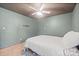 Bedroom features wood-look floors, a ceiling fan, and painted paneling for a unique look at 112 Gays Chapel Rd, Statesville, NC 28625