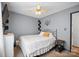 Neutral bedroom featuring standard ceiling fan and shelving unit at 112 Gays Chapel Rd, Statesville, NC 28625