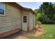 Back of home with a door leading to a yard with grass and a tree at 112 Gays Chapel Rd, Statesville, NC 28625