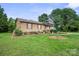 Classic home with a covered porch, green lawn, and shady trees at 112 Gays Chapel Rd, Statesville, NC 28625