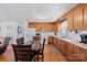 View of kitchen showcasing wood cabinets and white appliances at 112 Gays Chapel Rd, Statesville, NC 28625