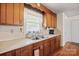 The kitchen has wood cabinets, a double basin sink, and a window at 112 Gays Chapel Rd, Statesville, NC 28625