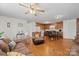 Open-concept living and kitchen area with hardwood floors and natural light at 112 Gays Chapel Rd, Statesville, NC 28625