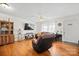 Inviting living room featuring hardwood floors, a ceiling fan, and natural light at 112 Gays Chapel Rd, Statesville, NC 28625