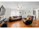 Bright living room with hardwood floors, a ceiling fan, and comfortable seating at 112 Gays Chapel Rd, Statesville, NC 28625