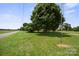 Expansive green yard with mature trees, offering a serene and picturesque setting at 112 Gays Chapel Rd, Statesville, NC 28625