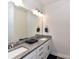 Elegant bathroom featuring double sinks with granite countertops and white cabinets at 121 Enclave Meadows Ln, Matthews, NC 28104