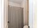 Clean bathroom with a white striped shower curtain and modern fixtures at 121 Enclave Meadows Ln, Matthews, NC 28104