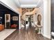 Grand foyer with dark hardwood floors and elegant staircase with modern chandelier at 121 Enclave Meadows Ln, Matthews, NC 28104