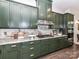 Close up of kitchen with gas cooktop, modern cabinets, marble backsplash, and stainless hood at 121 Enclave Meadows Ln, Matthews, NC 28104