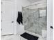 Modern glass enclosed shower with built-in seating, and stunning marble design at 121 Enclave Meadows Ln, Matthews, NC 28104