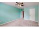 Bedroom featuring neutral carpet, a ceiling fan, closet space, and fresh paint at 12222 Stratfield Place Cir, Pineville, NC 28134