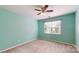 Cozy bedroom featuring soft carpet, a ceiling fan, and a window with natural light at 12222 Stratfield Place Cir, Pineville, NC 28134