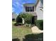 Charming home featuring lush landscaping, a brick entryway, and well-maintained lawn at 12222 Stratfield Place Cir, Pineville, NC 28134