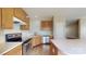 Bright kitchen featuring oak cabinets, stainless steel appliances, and laminate countertops at 12222 Stratfield Place Cir, Pineville, NC 28134