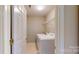 Bright laundry room featuring modern washer and dryer at 12222 Stratfield Place Cir, Pineville, NC 28134