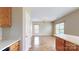 Bright, open living room featuring hardwood floors, a chandelier, and natural light from multiple windows at 12222 Stratfield Place Cir, Pineville, NC 28134