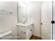 Bathroom featuring a white vanity and sink with modern fixtures, plus a toilet at 123 Prestwick Way # 42, Mooresville, NC 28115