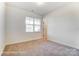 Bright bedroom featuring a window and neutral carpeting providing a comfortable atmosphere at 123 Prestwick Way # 42, Mooresville, NC 28115