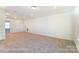 A very spacious bonus room featuring neutral colors, carpet, and recessed lighting at 123 Prestwick Way # 42, Mooresville, NC 28115