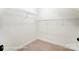 Walk-in closet with carpet flooring and installed wire shelving for optimal storage at 123 Prestwick Way # 42, Mooresville, NC 28115