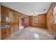 Bedroom with wood paneling, neutral carpet and a ceiling fan at 1333 Washington Ln, Kannapolis, NC 28083
