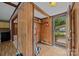 Entryway featuring wood paneling and an open door to the outside at 1333 Washington Ln, Kannapolis, NC 28083