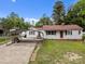 Charming single-story home features a covered parking, well-manicured lawn, and welcoming curb appeal at 1333 Washington Ln, Kannapolis, NC 28083