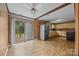 Bright kitchen features stainless steel refrigerator, ample cabinetry, and access to the outdoor deck at 1333 Washington Ln, Kannapolis, NC 28083