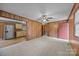 Spacious room with wood-paneled walls leads into the adjacent kitchen with stainless steel appliances at 1333 Washington Ln, Kannapolis, NC 28083