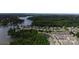 Picturesque aerial view showcasing the neighborhood's lake access and tree-lined streets at 137 Flora Vista Dr, Mooresville, NC 28117