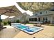 Relaxing backyard featuring a hot tub, a spacious deck, and mature landscaping perfect for entertaining at 137 Flora Vista Dr, Mooresville, NC 28117