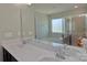 Bathroom featuring double sink vanity, shower, tub, and large mirror at 137 Flora Vista Dr, Mooresville, NC 28117