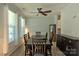 Traditional dining room featuring hardwood floors, an elegant table, and a stylish ceiling fan at 137 Flora Vista Dr, Mooresville, NC 28117