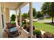 Inviting front porch with seating area and landscaped garden, perfect for enjoying peaceful outdoor moments at 137 Flora Vista Dr, Mooresville, NC 28117