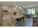 Bright kitchen with granite island, stainless steel appliances, and an adjacent dining area at 137 Flora Vista Dr, Mooresville, NC 28117
