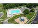 Aerial view of the community pool and adjacent playground, perfect for Gathering fun and recreation at 137 Flora Vista Dr, Mooresville, NC 28117