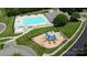 Aerial view of the community pool and adjacent playground, perfect for Gathering fun and recreation at 137 Flora Vista Dr, Mooresville, NC 28117