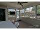 Enclosed sunroom with large windows offering plenty of natural light and views of the backyard at 137 Flora Vista Dr, Mooresville, NC 28117