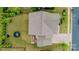 An aerial view shows the property's layout, a well-maintained lawn, patio and driveway, and surrounding greenery at 14228 Twin Eagles Ln, Charlotte, NC 28278