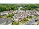 A neighborhood with beautiful homes and mature trees nestled near a serene lake at 14228 Twin Eagles Ln, Charlotte, NC 28278
