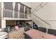 Outdoor area with a patio, dining table, grill, and stairs to the screened porch at 14228 Twin Eagles Ln, Charlotte, NC 28278