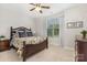 Cozy bedroom with a wooden bed frame, dresser, and large window at 14228 Twin Eagles Ln, Charlotte, NC 28278