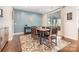 Stylish dining room with a modern blue accent wall and elegant decor at 14228 Twin Eagles Ln, Charlotte, NC 28278
