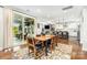 Open floor plan with view of the screened porch, fireplace, and kitchen at 14228 Twin Eagles Ln, Charlotte, NC 28278